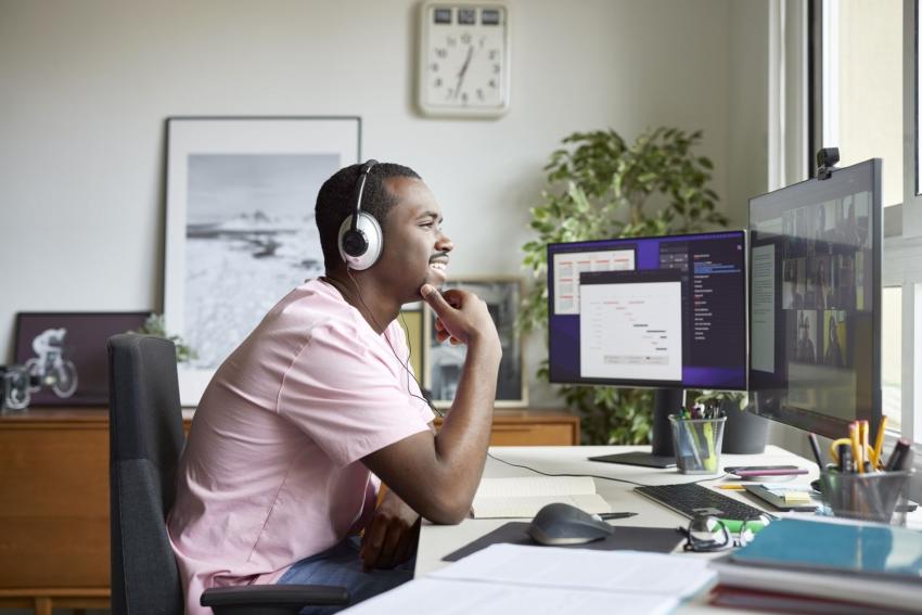 Man with headphones working in a home office
