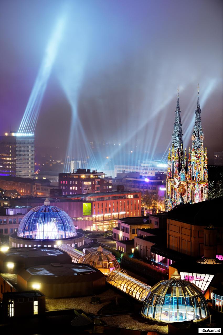 Rooftop view of lights in the sky and on buildings during Glow Eindhoven