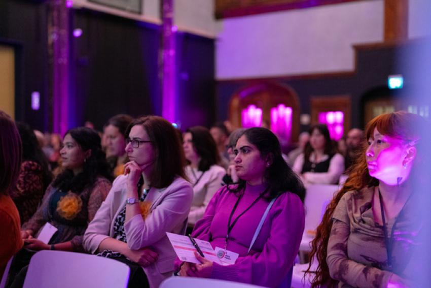 Ajudience at a Women for Women event