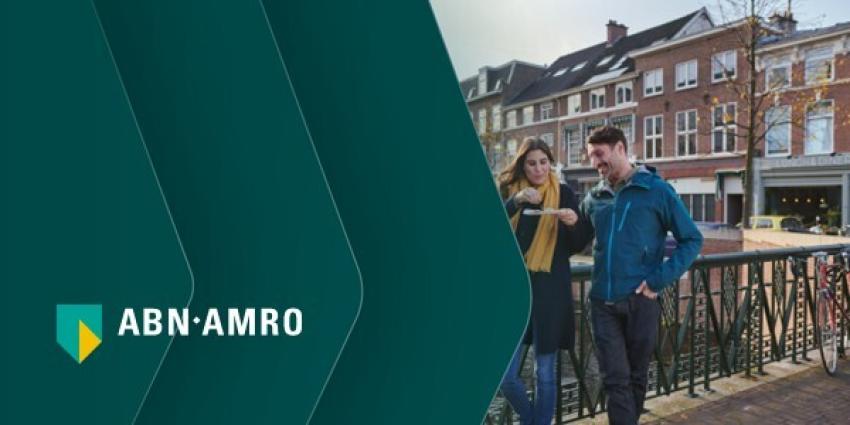 ABN AMRO logo alongside a couple standing on a bridge