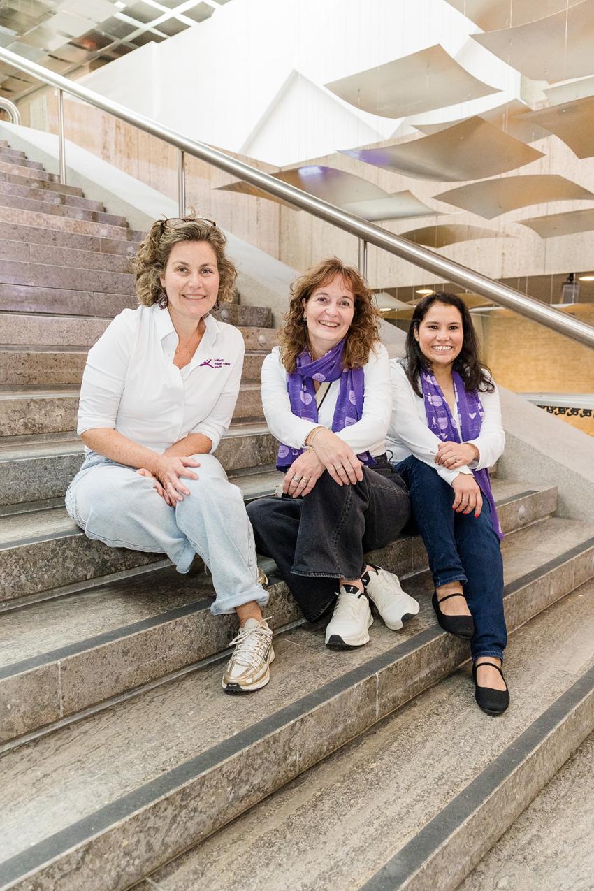 The organizers wearing purple cheat-sheet scarves