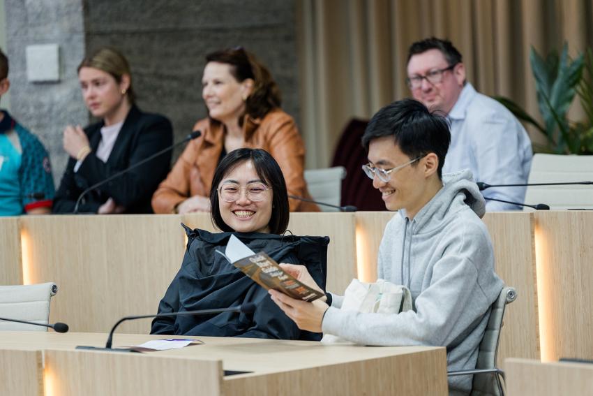 Smiling audience at a presentation