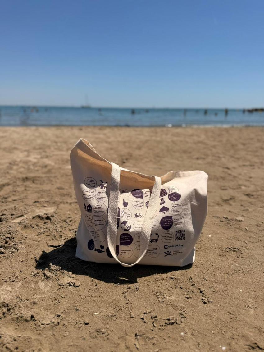 Praat Nederlands Met Me beach tote bag on a beach
