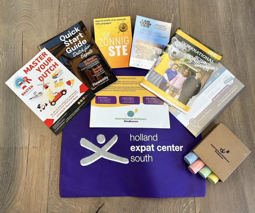 Welcome bag with flyers from Commercial Partners in education, childcare and language