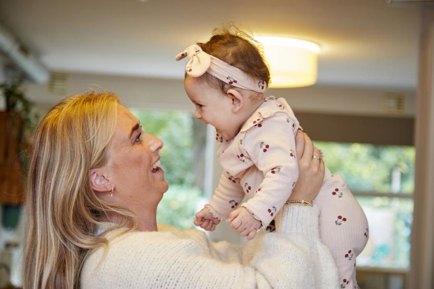 Smiling woman and baby