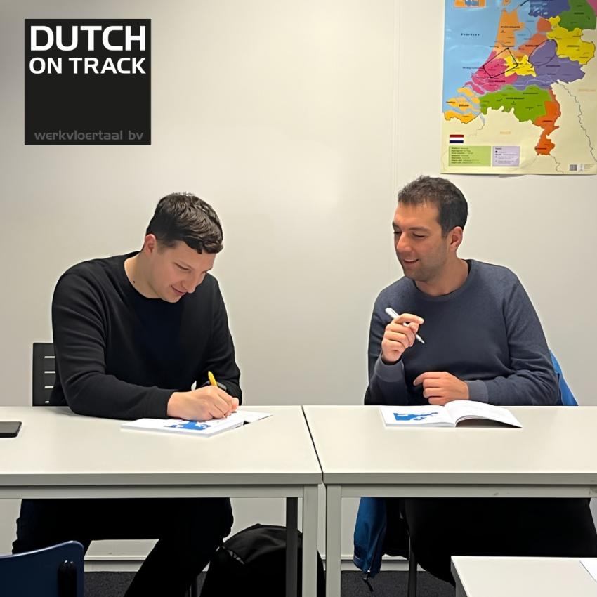 Two language learners sitting in a Dutch on Track classroom