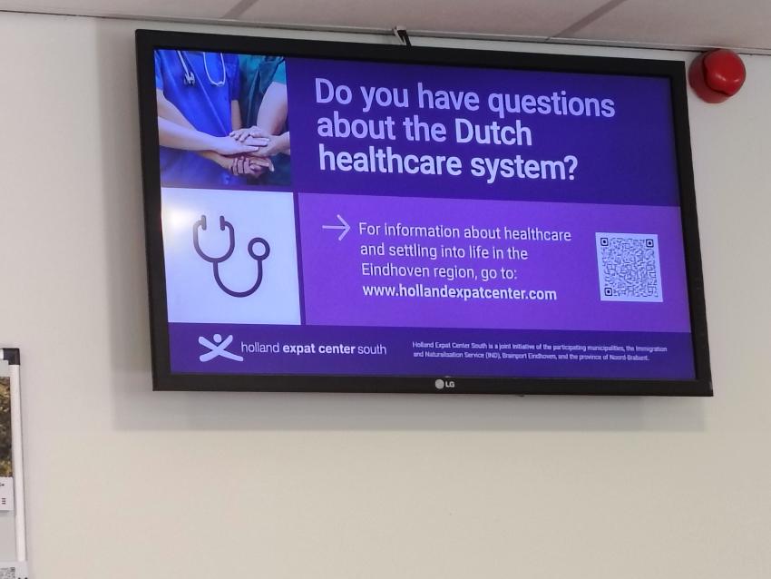 Digital screen showing link to information about the Dutch healthcare system