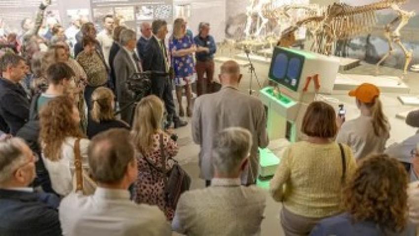 Visitors around a display at an exhibition at the Klok en Peel museum