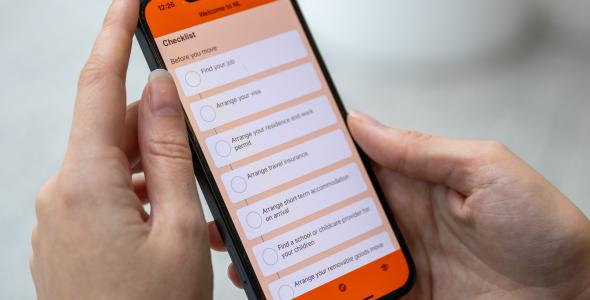 Photo of mobile phone with relocation app open