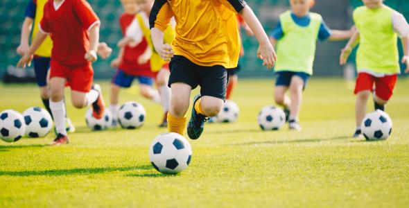Photo of children playing football