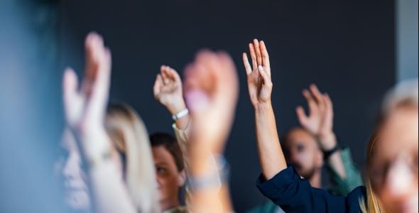photo of people with raised hands