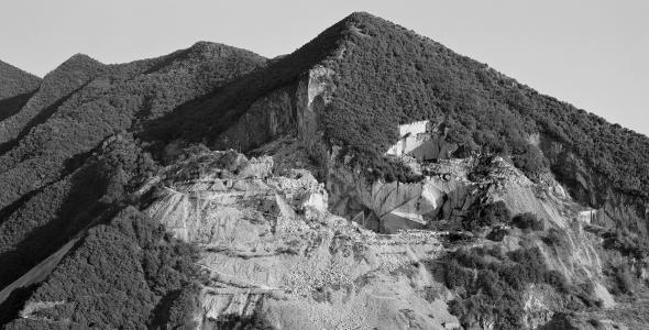 Black and white photo of marble quarrying in Carrara