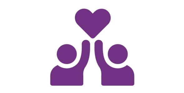 Two people, each with a raised arm, together holding a heart above their heads
