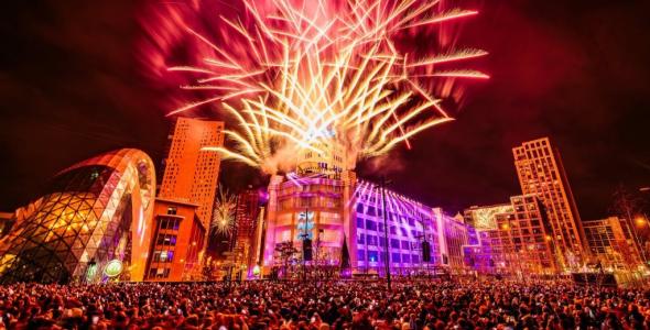 Crowd watching light show and fireworks at New Years EHVE