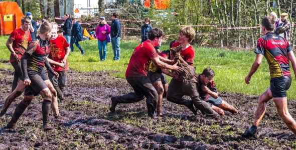 Participants in a mud field